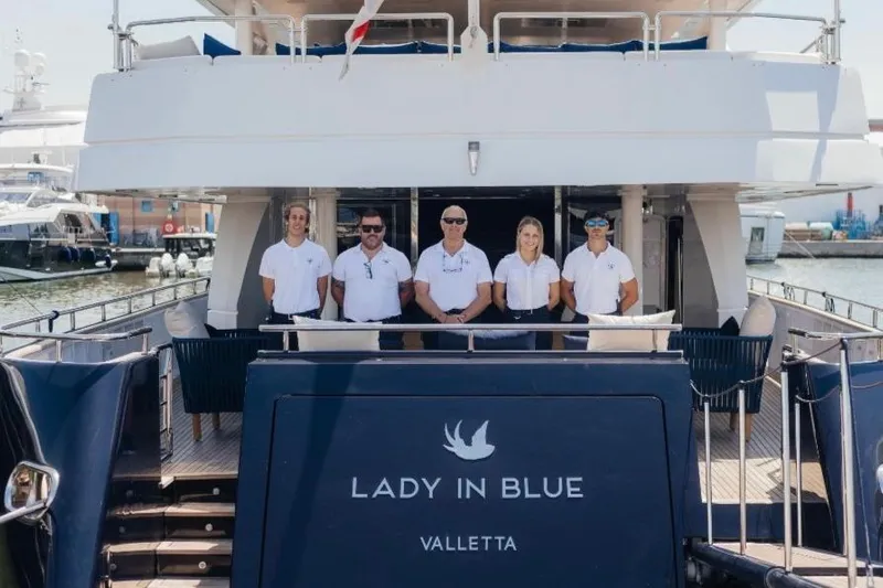 Lady In Blue Yacht Photos Pics Crew standing on Clemna Rossi Navi 135 yacht "Lady in Blue," Valletta, 1999 model.
