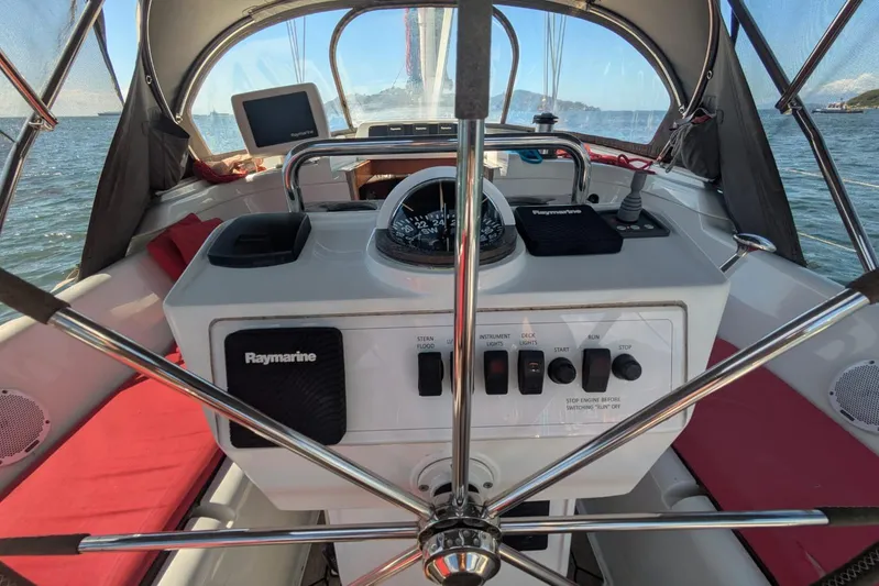 Making Time Yacht Photos Pics Cockpit of 2004 Oyster 53 sailboat with Raymarine navigation equipment and steering wheel.