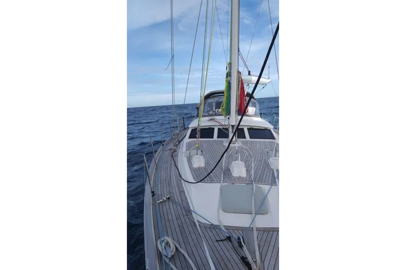 Making Time Yacht Photos Pics Sailing yacht Oyster 53, 2005 model, on open sea with clear skies.