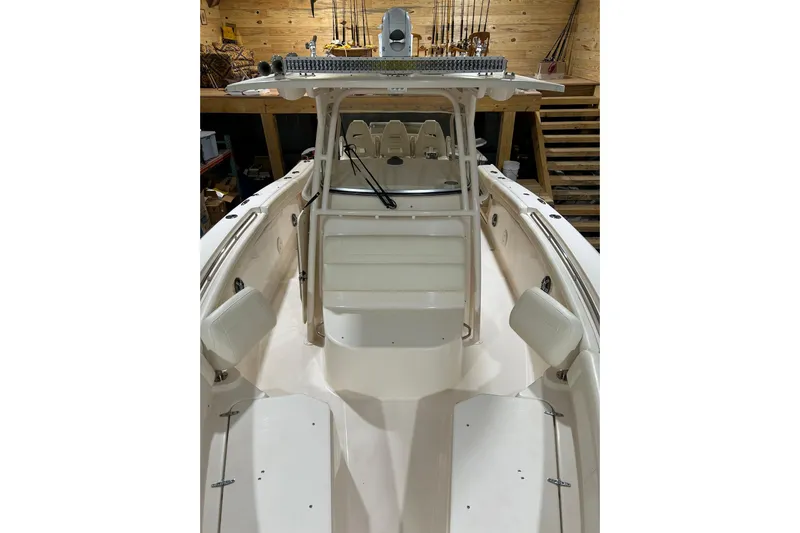  Yacht Photos Pics 2019 Grady-White Canyon 336 boat interior with seating and fishing equipment.