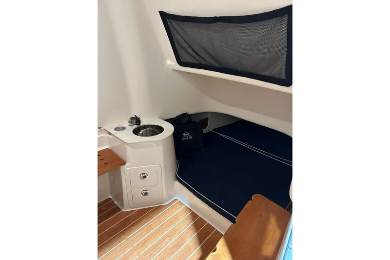  Yacht Photos Pics 2019 Grady-White Canyon 336 cabin interior with sink and seating area.