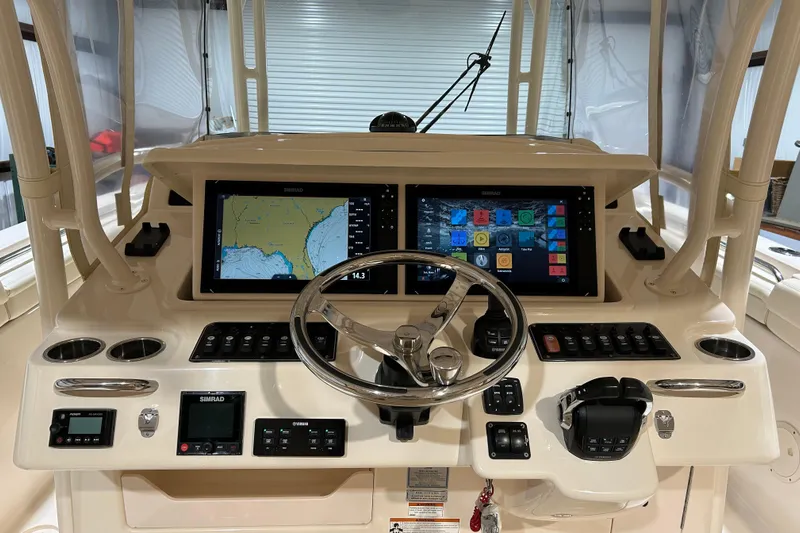  Yacht Photos Pics 2019 Grady-White Canyon 336 helm with dual Simrad displays and modern controls.