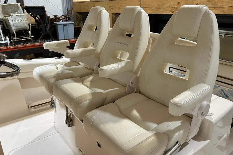  Yacht Photos Pics 2019 Grady-White Canyon 336 boat seats, cream leather, triple seating arrangement.