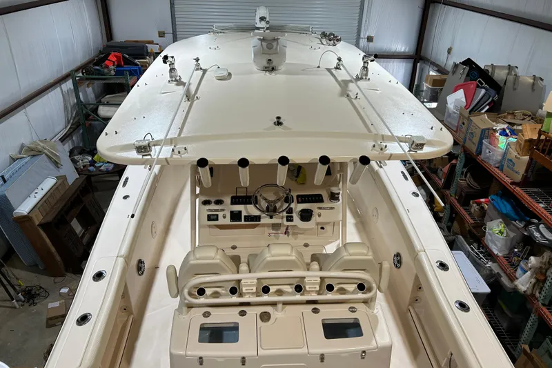  Yacht Photos Pics 2019 Grady-White Canyon 336 boat in storage, showcasing helm and seating area.