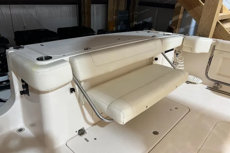  Yacht Photos Pics 2019 Grady-White Canyon 336 boat interior with foldable seating and cup holders.