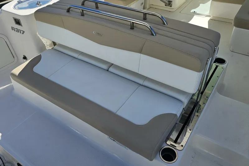 Yacht Photos Pics 2018 Robalo R317 Dual Console boat seating with beige and white upholstery.