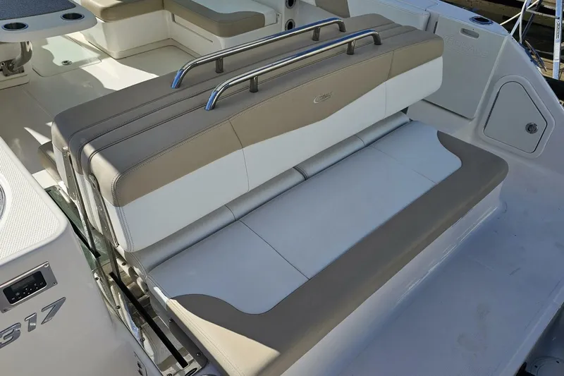  Yacht Photos Pics 2018 Robalo R317 Dual Console boat seating area with beige and white upholstery.