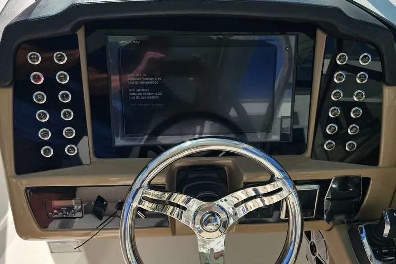  Yacht Photos Pics Dashboard of 2018 Robalo R317 Dual Console boat with steering wheel and control panel.