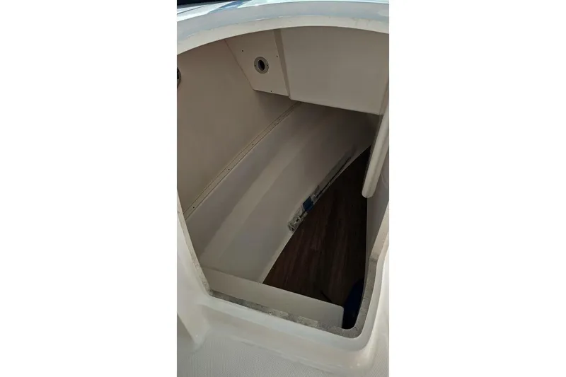  Yacht Photos Pics Interior cabin of 2018 Robalo R317 Dual Console boat, featuring storage space.