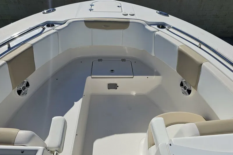  Yacht Photos Pics 2018 Robalo R317 Dual Console boat interior with cushioned seating and speakers.