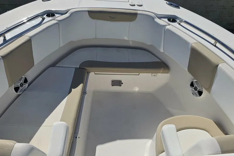  Yacht Photos Pics 2018 Robalo R317 Dual Console boat interior with cushioned seating and speakers.