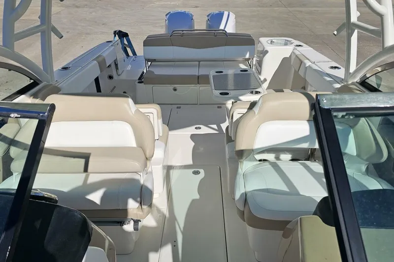  Yacht Photos Pics 2018 Robalo R317 Dual Console boat interior with beige and white seating.