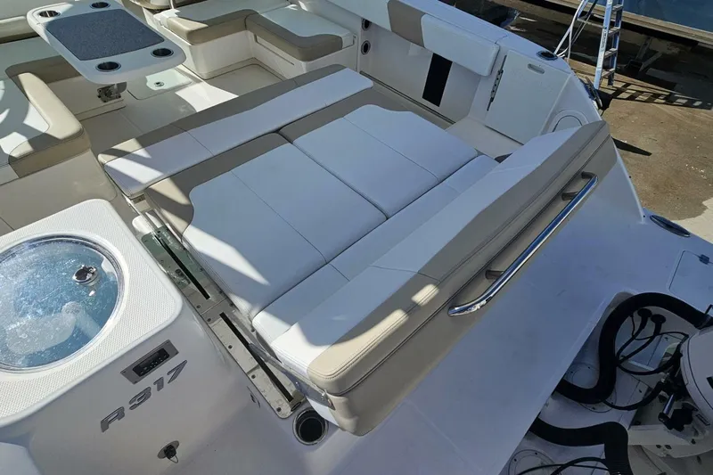  Yacht Photos Pics 2018 Robalo R317 Dual Console boat interior with seating and table.
