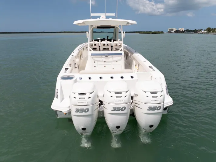  Yacht Photos Pics 2019 Boston Whaler 350 Outrage with triple 350 engines on calm water.