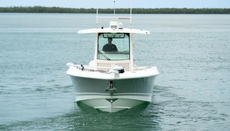  Yacht Photos Pics 2019 Boston Whaler 350 Outrage boat cruising on calm water.