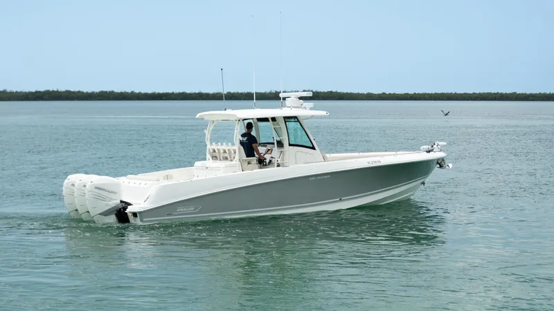  Yacht Photos Pics 2019 Boston Whaler 350 Outrage cruising on calm waters.