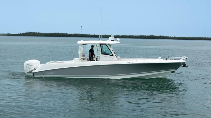 Yacht Photos Pics 2019 Boston Whaler 350 Outrage boat cruising on calm waters.