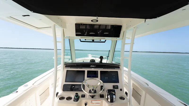  Yacht Photos Pics 2019 Boston Whaler 350 Outrage helm view on open water.