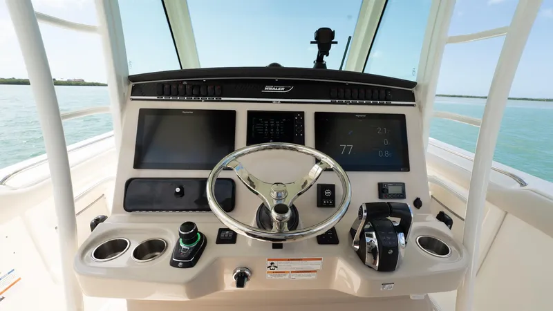  Yacht Photos Pics 2019 Boston Whaler 350 Outrage helm with modern controls and navigation screens.