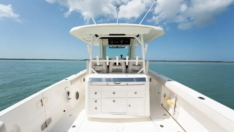  Yacht Photos Pics 2019 Boston Whaler 350 Outrage boat interior with ocean view and clear sky.