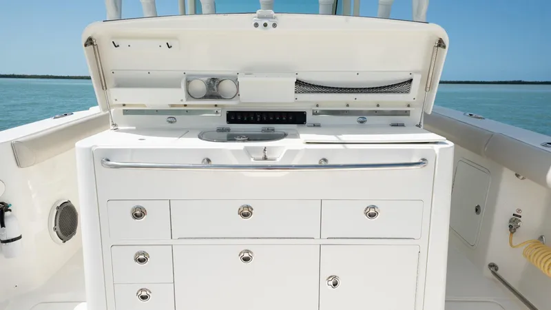  Yacht Photos Pics 2019 Boston Whaler 350 Outrage boat interior with storage compartments and ocean view.