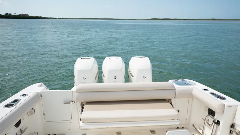  Yacht Photos Pics 2019 Boston Whaler 350 Outrage boat with triple engines on calm water.