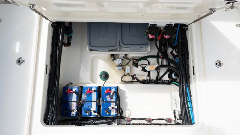  Yacht Photos Pics 2019 Boston Whaler 350 Outrage boat electrical compartment with batteries and wiring.
