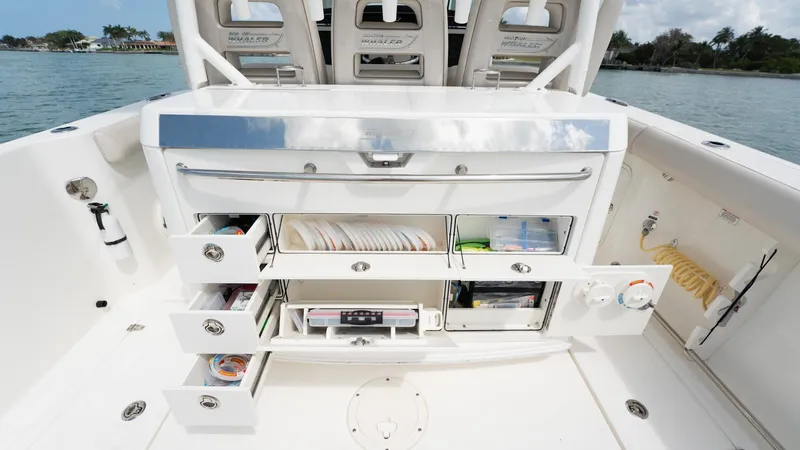  Yacht Photos Pics 2019 Boston Whaler 350 Outrage boat interior with open storage compartments.