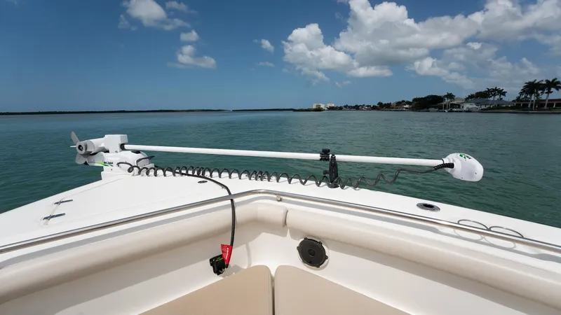  Yacht Photos Pics 2019 Boston Whaler 350 Outrage boat on calm water under blue sky.