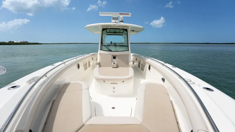  Yacht Photos Pics 2019 Boston Whaler 350 Outrage boat on calm water under blue sky.