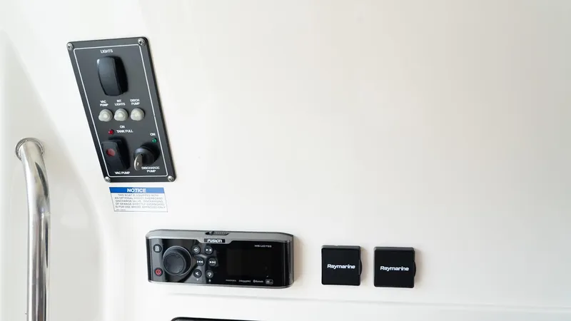  Yacht Photos Pics Control panel of 2019 Boston Whaler 350 Outrage boat, featuring navigation and audio controls.