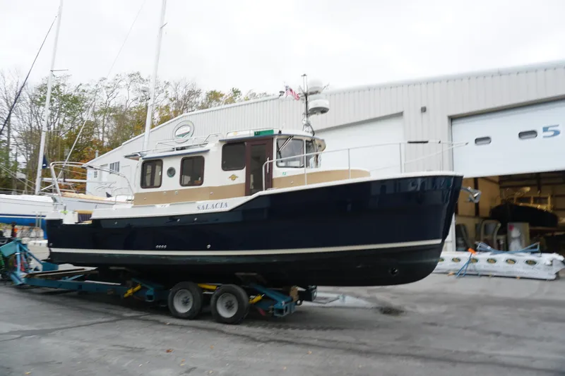  Yacht Photos Pics 2013 Ranger Tugs S-31 boat on trailer outside a storage facility.