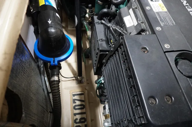  Yacht Photos Pics Engine compartment of a 2013 Ranger Tugs S-31 boat, showcasing mechanical components.