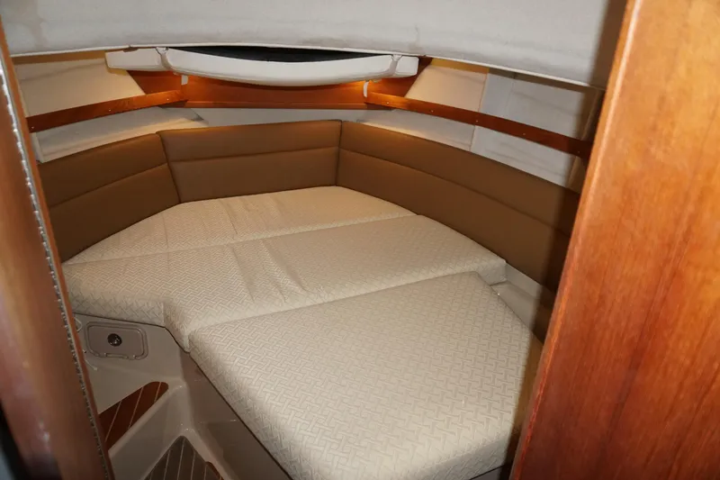  Yacht Photos Pics 2013 Ranger Tugs S-31 cabin interior with beige cushions and wood accents.