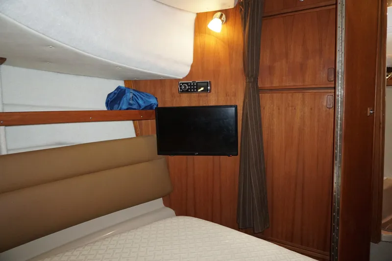  Yacht Photos Pics Interior cabin of 2013 Ranger Tugs S-31 with TV and wooden paneling.