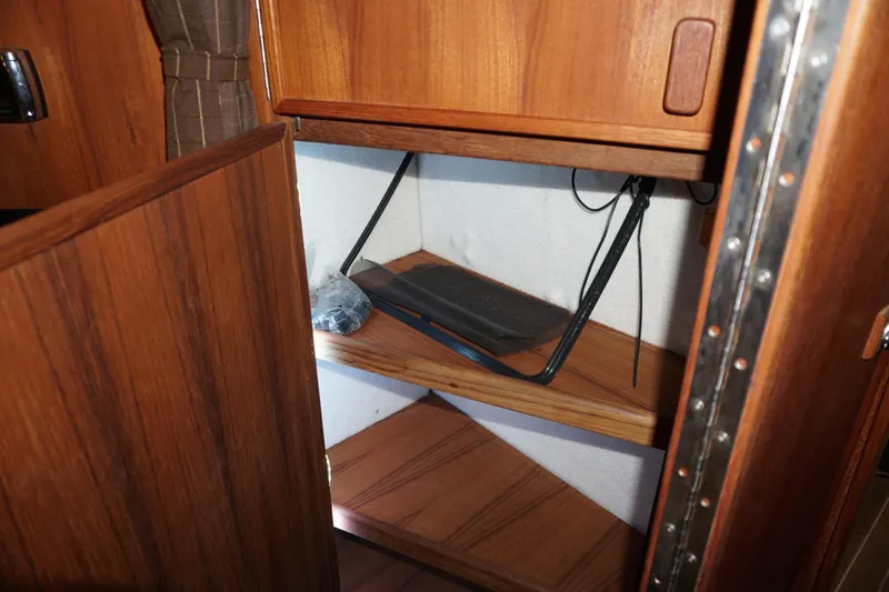  Yacht Photos Pics Wooden storage shelves inside a 2013 Ranger Tugs S-31 boat cabin.