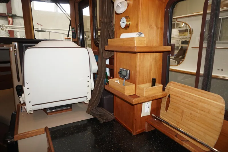 Yacht Photos Pics Interior of 2013 Ranger Tugs S-31 boat with wooden shelves and seating.