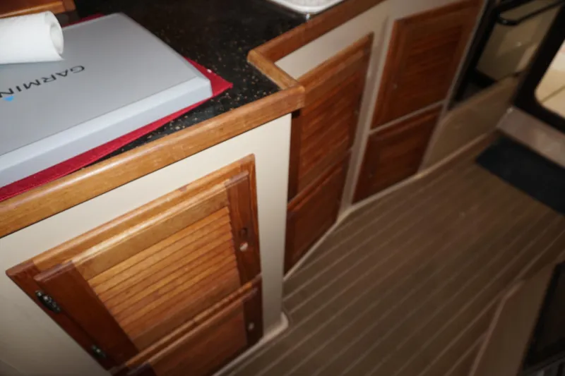  Yacht Photos Pics Interior of 2013 Ranger Tugs S-31 with wooden cabinets and Garmin equipment.