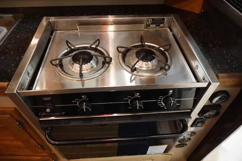  Yacht Photos Pics Stainless steel two-burner stove in 2013 Ranger Tugs S-31 boat kitchen.