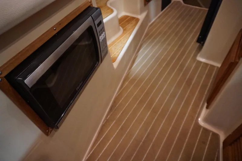  Yacht Photos Pics Interior of 2013 Ranger Tugs S-31 with microwave and wooden steps.