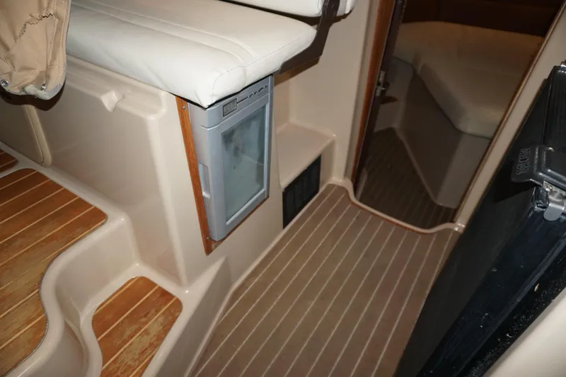  Yacht Photos Pics 2013 Ranger Tugs S-31 interior with wood flooring and compact seating area.