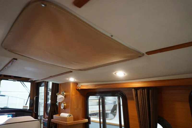  Yacht Photos Pics Interior of 2013 Ranger Tugs S-31 boat with wood accents and lighting.