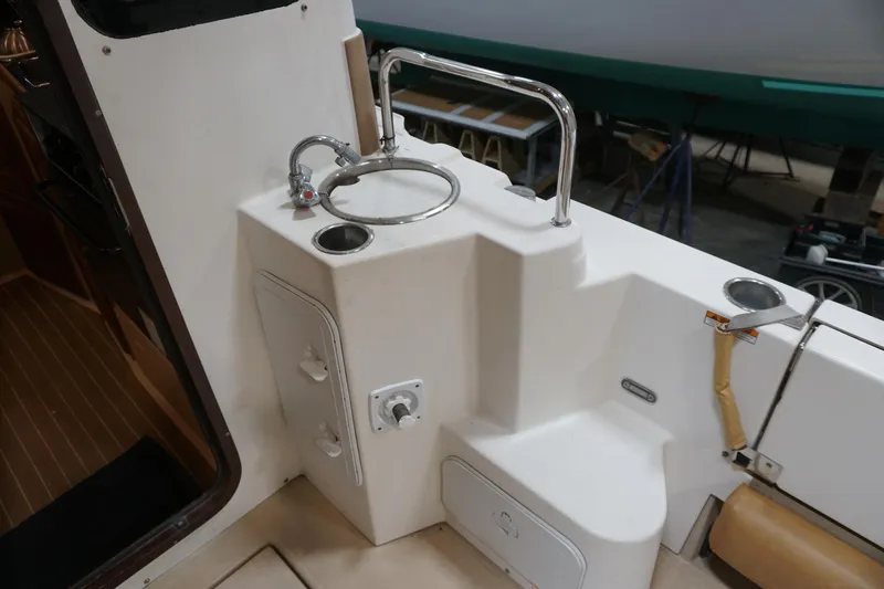  Yacht Photos Pics 2013 Ranger Tugs S-31 boat interior with sink and storage compartments.