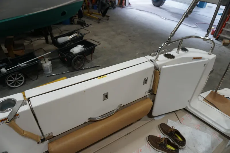  Yacht Photos Pics 2013 Ranger Tugs S-31 boat interior with seating and storage, in a workshop setting.