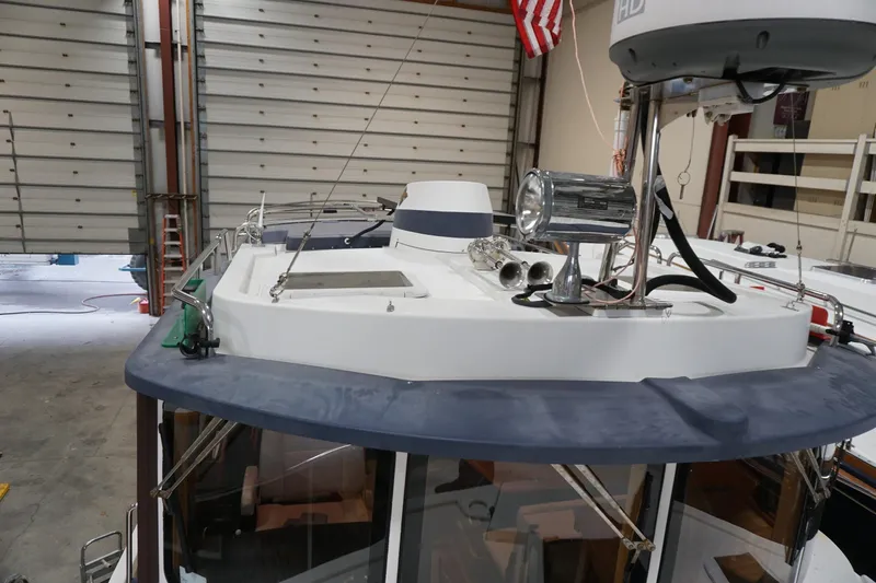  Yacht Photos Pics 2013 Ranger Tugs S-31 boat in a garage, featuring radar and spotlight equipment.