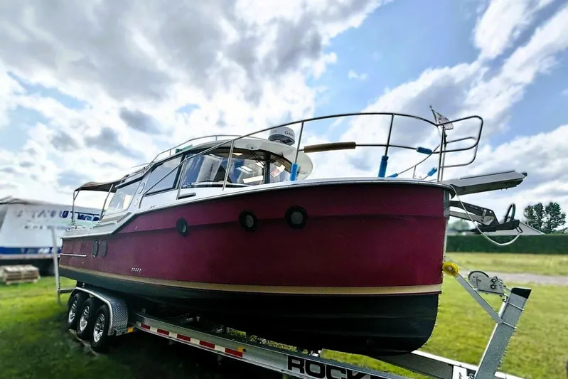  Yacht Photos Pics 2017 Ranger Tugs R-29S boat on trailer under cloudy sky.