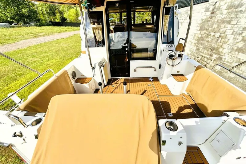  Yacht Photos Pics 2017 Ranger Tugs R-29S boat interior with tan seating and wooden deck.