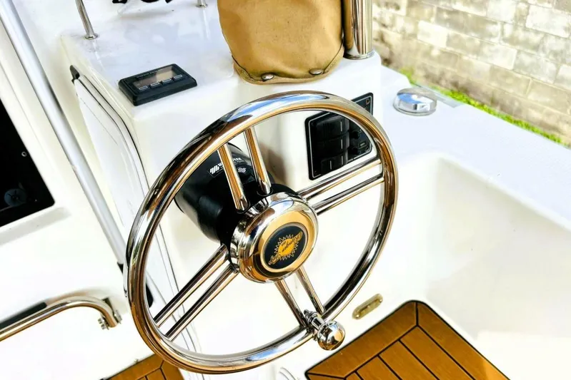  Yacht Photos Pics Steering wheel of 2017 Ranger Tugs R-29S boat with teak flooring.