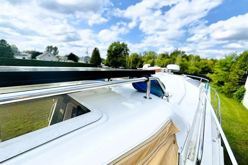  Yacht Photos Pics 2017 Ranger Tugs R-29S boat deck with clear sky and lush greenery.