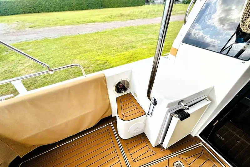  Yacht Photos Pics 2017 Ranger Tugs R-29S boat deck with wood finish and outdoor seating.